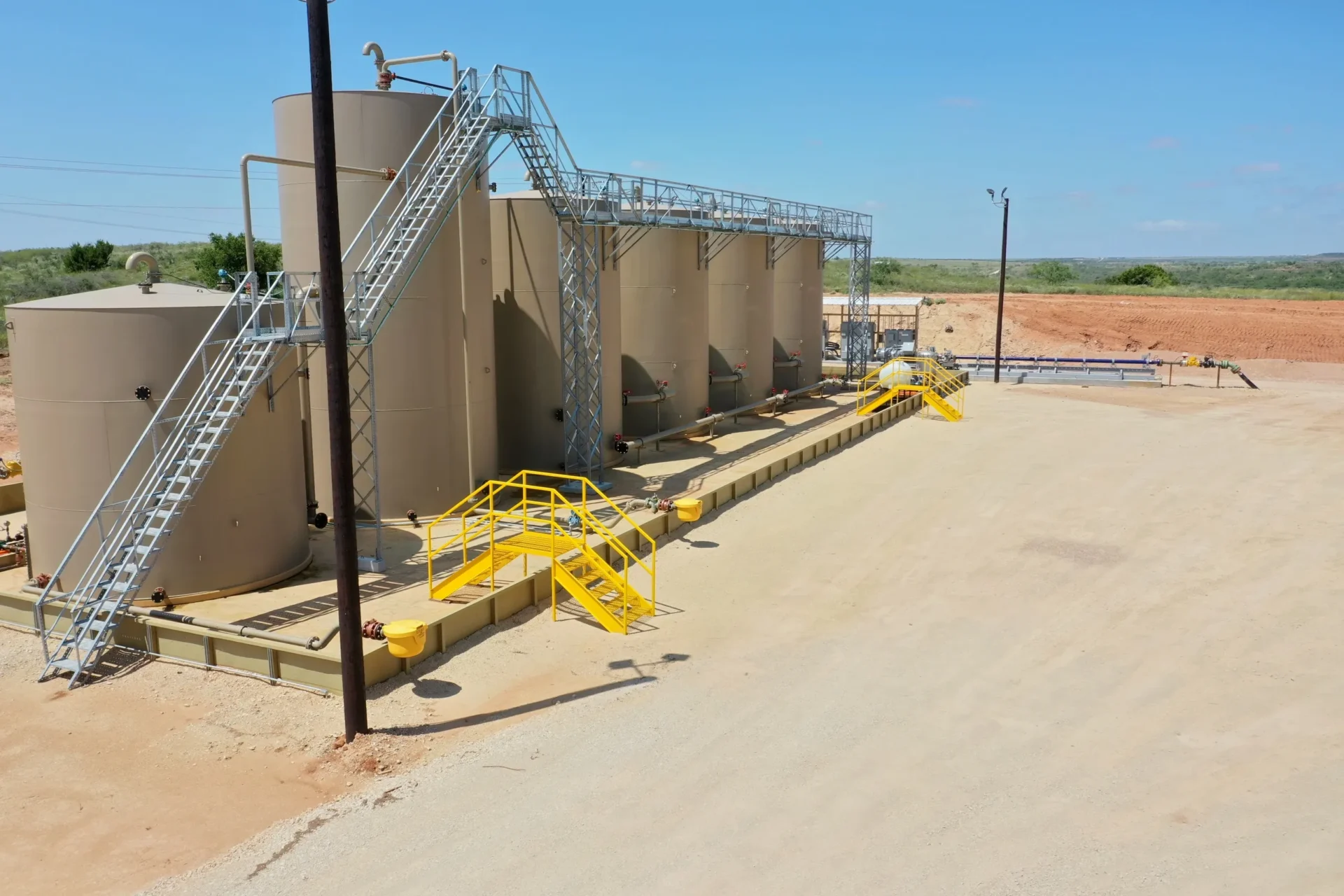 A large yellow and white structure on the side of a road.